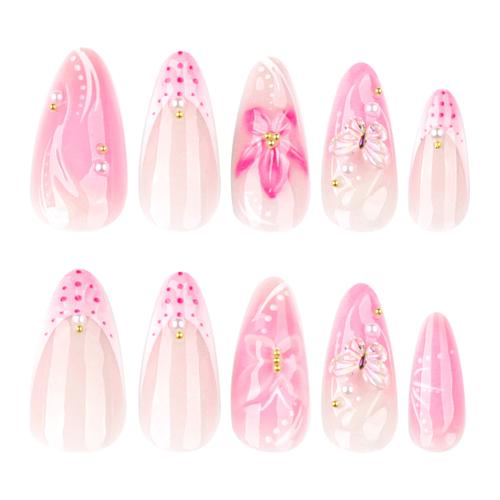 Short almond-shaped nail art with French-style pink color. Wearable artificial nails with 3D flower-shaped nail pieces.